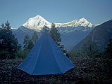 108 My Tent At Shepherds Kharka With Dhaulagiri and Tukuche Peak We arrived in stands of evergreen trees in a grassy hillock called Shephard�s Kharka (3760m) at 15:40 after climbing 1220m in three and a half hours, I looked across the deepest gorge in the world at Dhaulagiri and Tukuche Peak (6920m). The porters quickly set up my tent, and I crawled in to rest and read. A half hour later, they brought me milk tea and biscuits for my afternoon snack. Now, this is living! The porters had walk for half an hour each way to get water for dinner and breakfast.